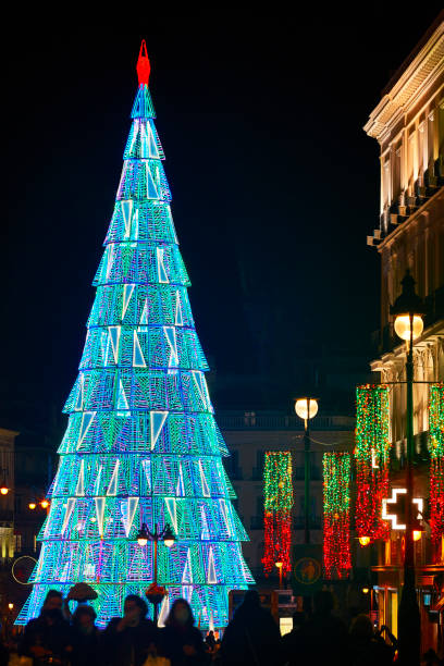 istock Urban illuminated Christmas tree blue tone. Madrid city center. 1299062778