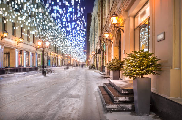 istock Glowing lanterns from the sky in Stoleshnikov Lane in Moscow 1299063945