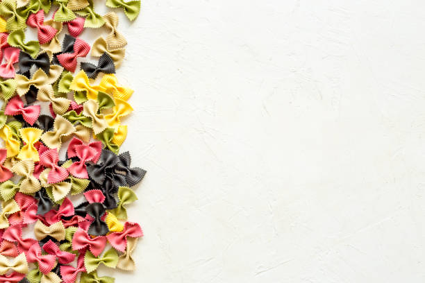 istock Coloured vegan pasta from beetroot and spinach, top view 1299066319
