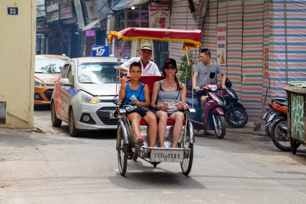 The Old Quarter, The Hanoi Street, rickshaw in the streets of Vietnam Hanoi, Vietnam - june 11, 2019: The Old Quarter, The Hanoi Street, rickshaw in the streets of Vietnam vietnamese man taxi motorbike driver stock pictures, royalty-free photos & images