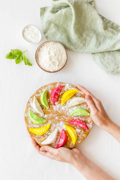 istock Colored vegetables dumplings or ravioli on cutting board 1299067140