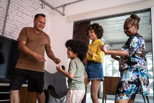 istock Multi generation family dancing at home 1299067952