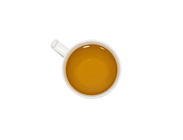 White cup of herbal tea top view isolated on a white background