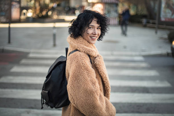 istock Woman walks crosswalk. 1299069678