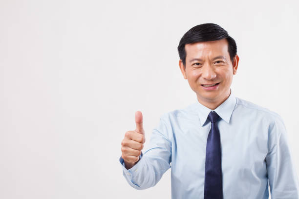 istock businessman pointing up thumb up gesture 1299070500