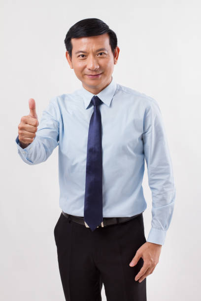 istock businessman pointing up thumb up gesture 1299070512