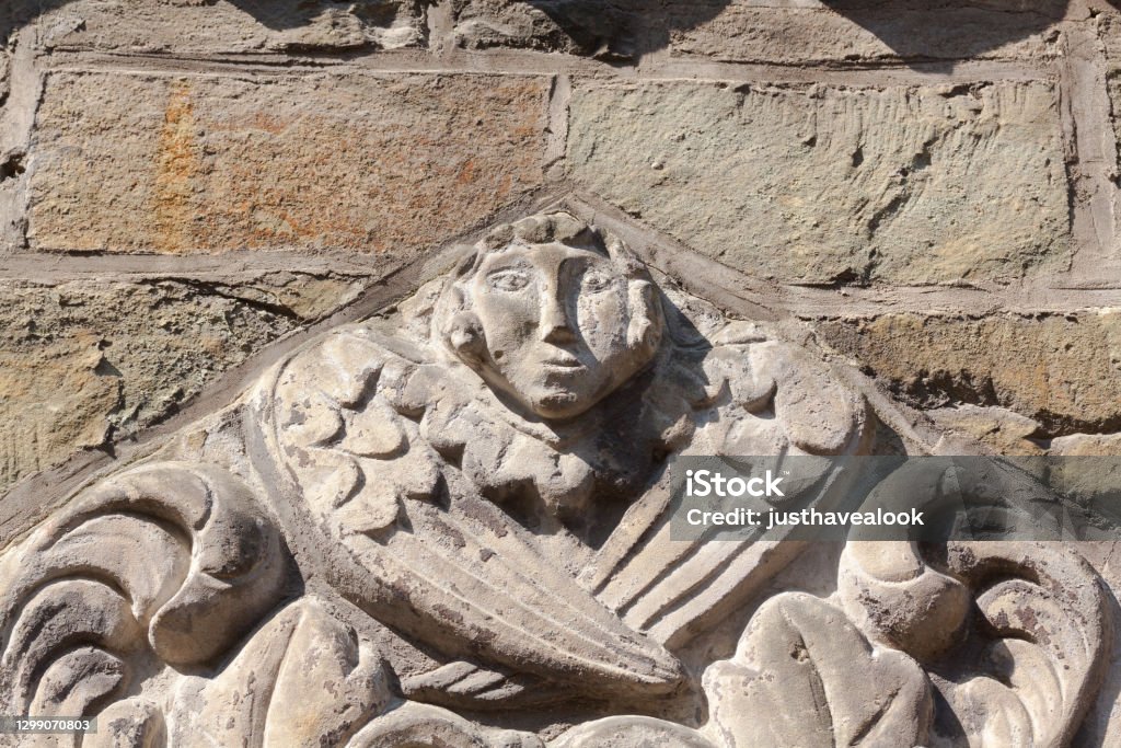 Angel relief at facade of church in Paderborn Angel Stock Photo