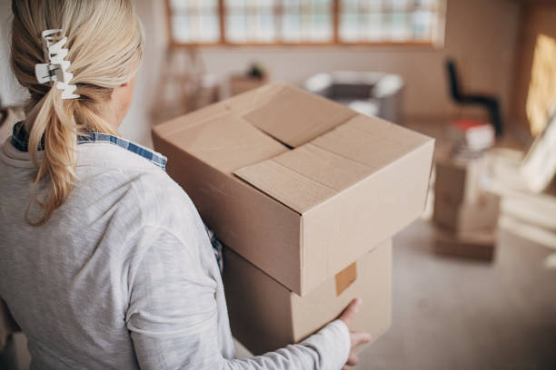 istock Senior woman moving in her new home 1299071165