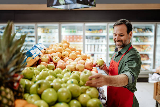 istock Latin American employee working in supermarket 1299071678