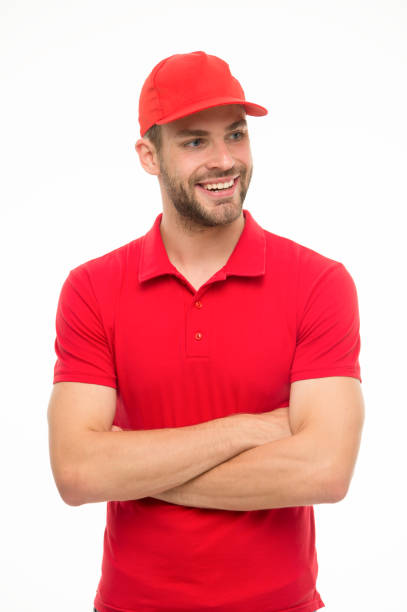 istock Trend for him. Confident guy. Happy guy keep arms crossed isolated on white. Handsome guy in casual style. Unshaven guy wear red cap and polo shirt. Fashion and style. Menswear store 1299071974
