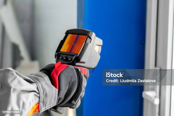 Thermal Imaging A Thermal Imager In The Hands Of An Electrician Conducting An Inspection Of The Equipment Stock Photo - Download Image Now
