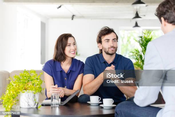 Couple Discussing With Financial Advisor Stock Photo - Download Image Now - Debt, Real Estate, Real Estate Agent