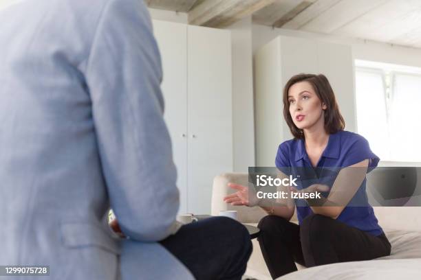 Woman Discussing Problems With Psychotherapist Stock Photo - Download Image Now - Mental Health Professional, Psychotherapy, Talking