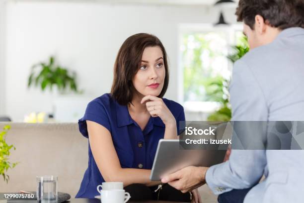 Woman Talking With Financial Advisor At Home Stock Photo - Download Image Now - Financial Advisor, Discussion, Home Interior
