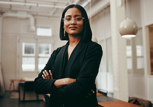 Portrait of a confident young businesswoman working in a modern office