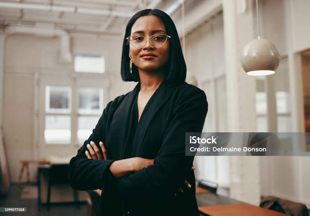 Lead yourself to a life of success Portrait of a confident young businesswoman working in a modern office Women Stock Photo
