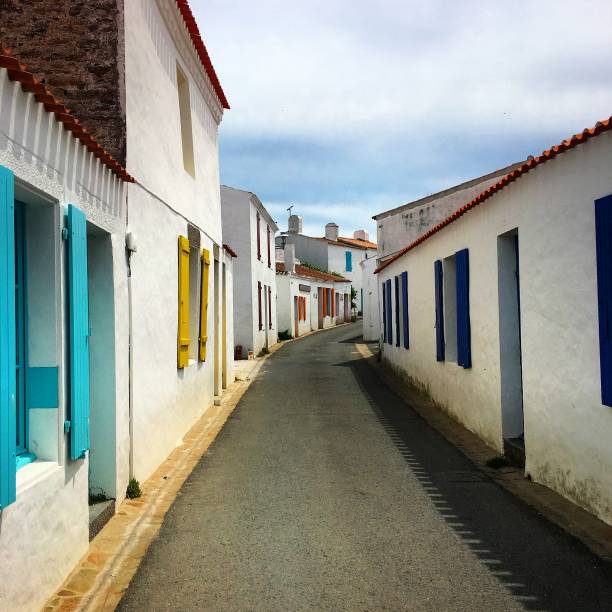 istock A colourful and quaint sunny little street. 1299078551