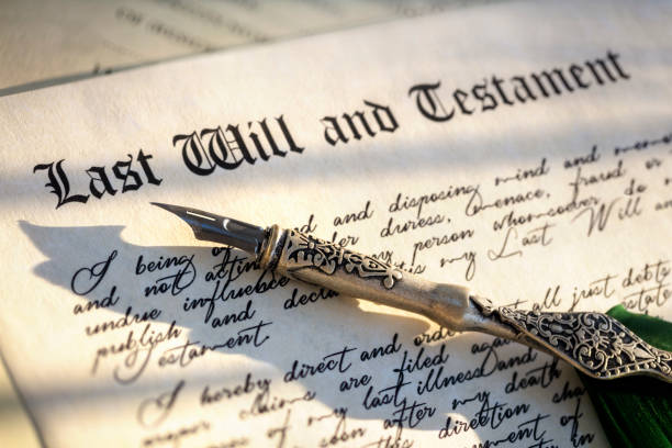 Signing Last Will and Testament legal document Signing Last Will and Testament legal document with quill pen last stock pictures, royalty-free photos & images