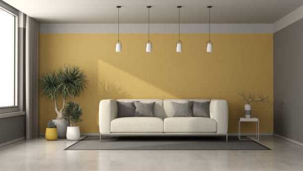istock Gray and yellow living room with modern sofa 1299080102