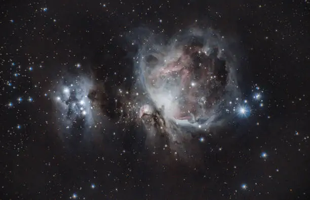 Orion Nebula & Horsehead Nebula. Surrounded by stars and other space gases.