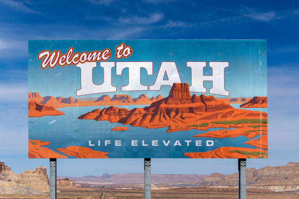 Road to Utah Welcome to Utah state sign along the road near Page in Arizona. page arizona stock pictures, royalty-free photos & images