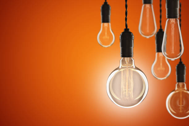 istock Idea and leadership concept Vintage incandescent Edison bulbs on 1299083327