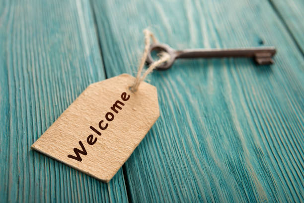 istock hotel key with welcome tag on the wooden background 1299083355