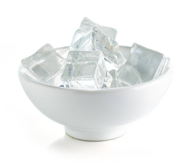 istock Bowl of ice cubes isolated on white background 1299083579
