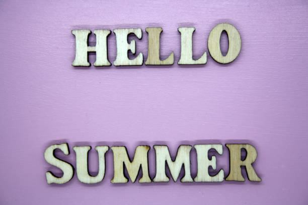 istock Text Hello summer wooden letter on pink background. 1299083764