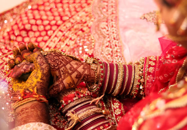 istock Bride and Groom hand in wedding. No People in frame 1299084272