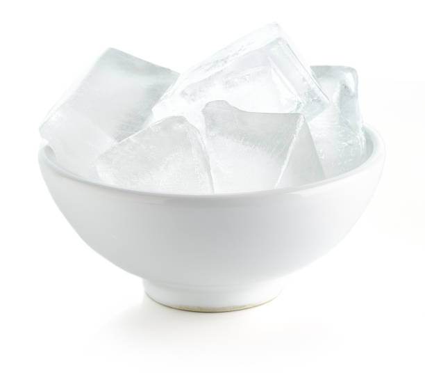 istock Bowl of ice cubes isolated on white background 1299084787