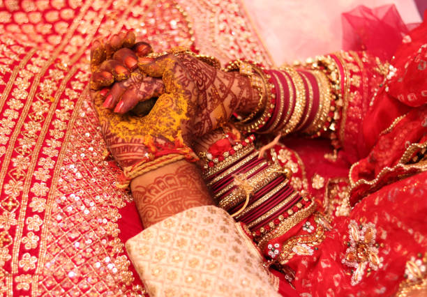 istock Bride and Groom hand in wedding. No People in frame 1299084816