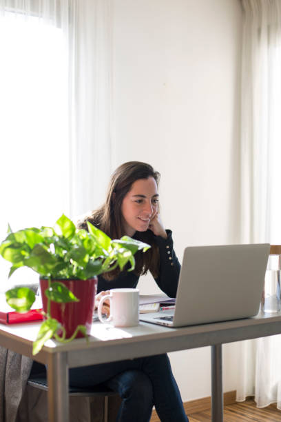 istock Young woman working at home 1299085647
