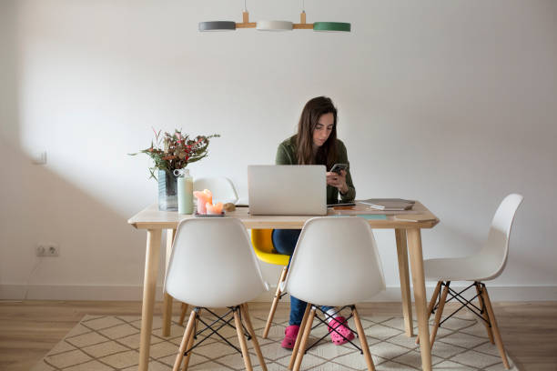 istock Young woman working at home 1299085698