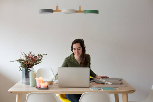istock Young woman working at home 1299086025
