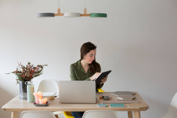istock Young woman working at home 1299086222