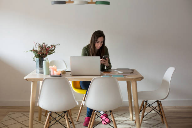 istock Young woman working at home 1299086236