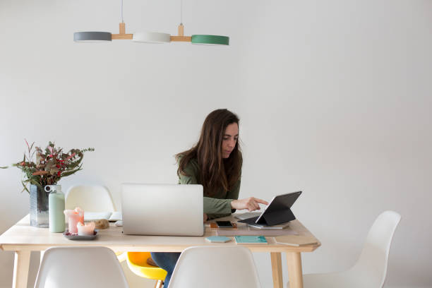 istock Young woman working at home 1299086282