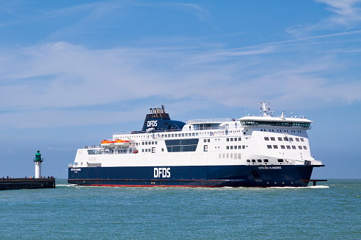 Calais, France - June 22 2020: Ferry entering the city's port.