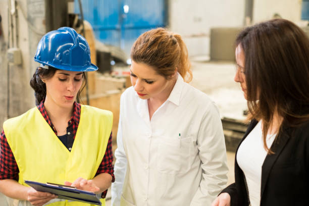 istock Women construction workers talk and planning the work in their company 1299086305