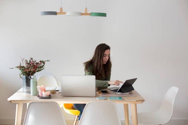 istock Young woman working at home 1299086310