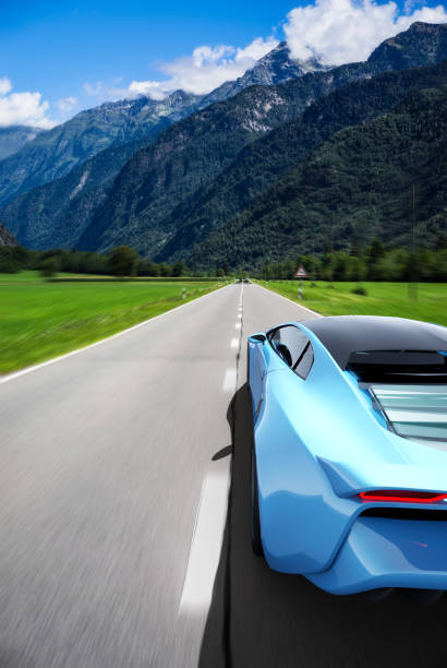 istock blue sportscar driving on a road 1299087865
