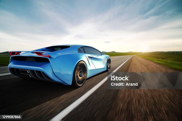 Blue Sportscar Driving On A Road Stock Photo - Download Image Now - Sports Car, Car, Speed