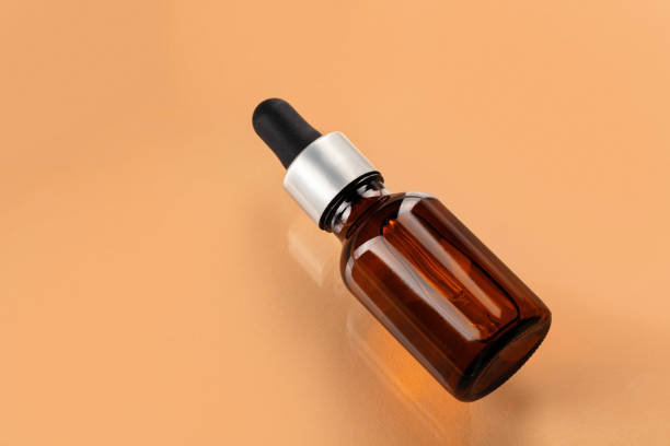 istock Skincare serum bottle on a light beige background 1299089744