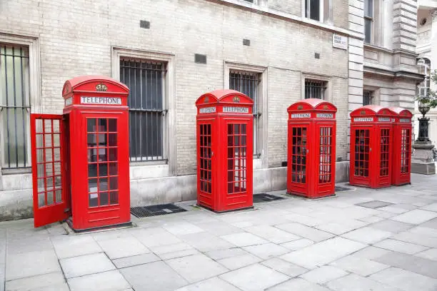 Photo of Famous red telephone booths in Covent Garden street, London, England