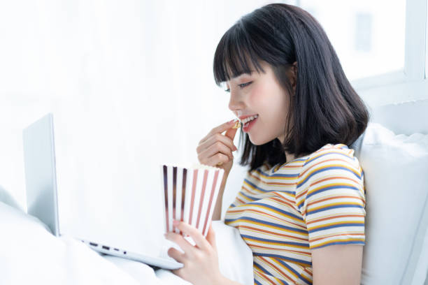 istock Watch movies in bed 1299092744