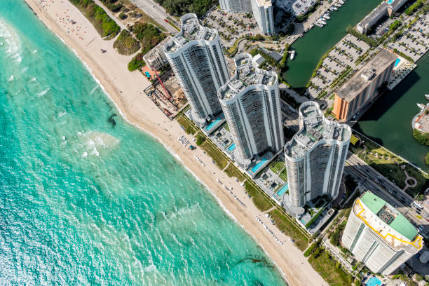Florida Beach Resort Aerial Aerial view of a South Florida beach resort shot from directly overhead at about 1000 feet in altitude. florida beach above stock pictures, royalty-free photos & images