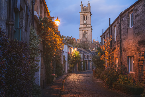 The picturesque and historic Circus Lane and Saint Stephen's Church at dusk in the Stockbridge neighbourhood of Edinburgh, Scotland