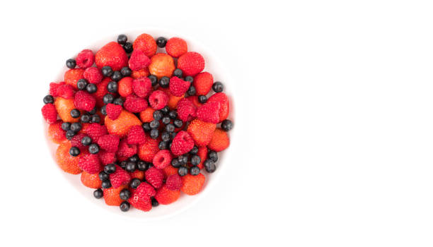 istock Berries in a large assortment on a white background. Berry background, trading platform 1299099863