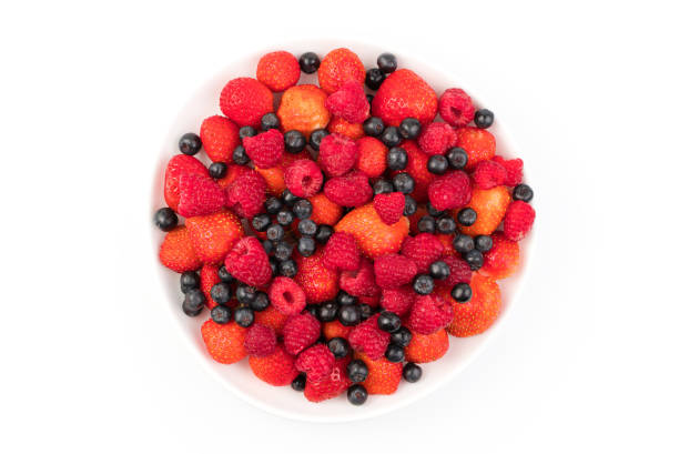 istock Fresh strawberries, raspberries, mountain ash in a plate on a light background 1299100368